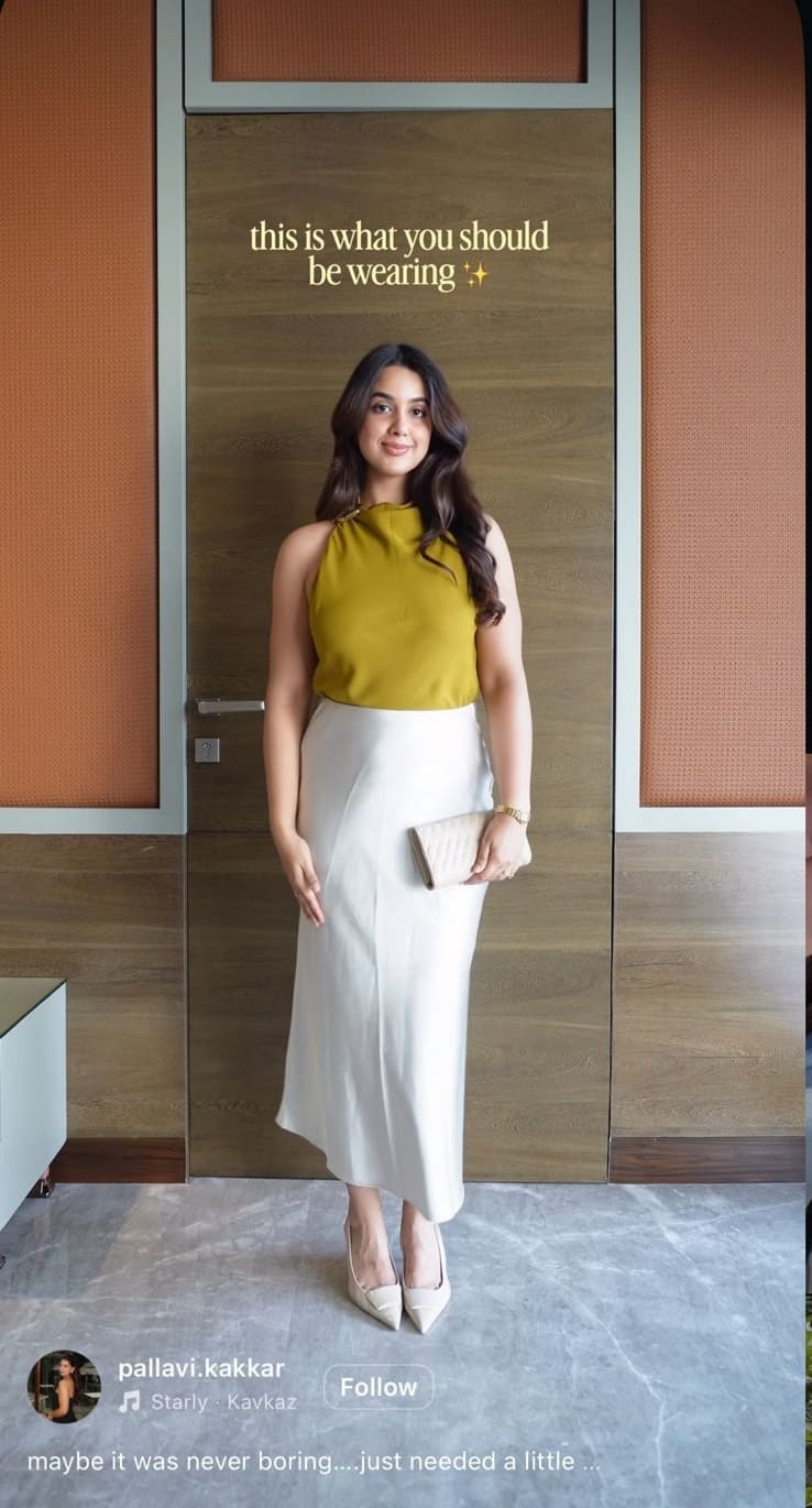 Mustard halter top with a cream satin slip skirt and pointed nude heels