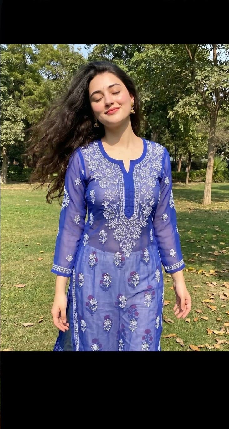 Royal blue chikankari suit with white embroidery in sunlit garden