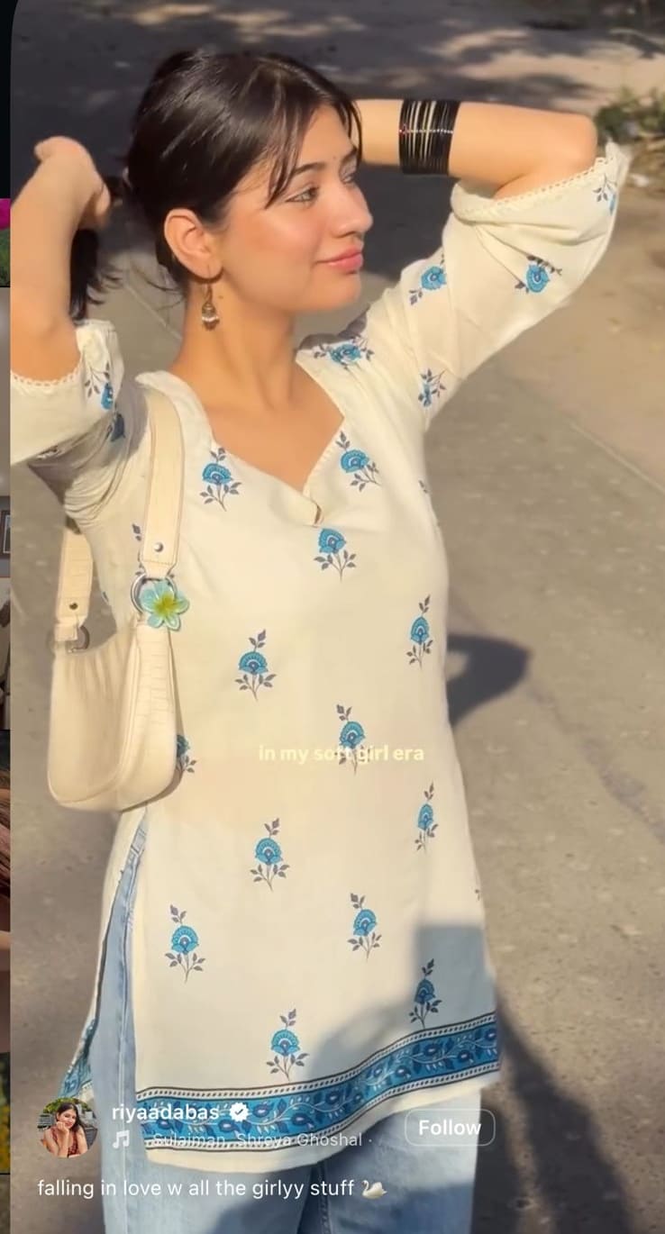 White kurti with blue floral block print and silver jhumka earrings